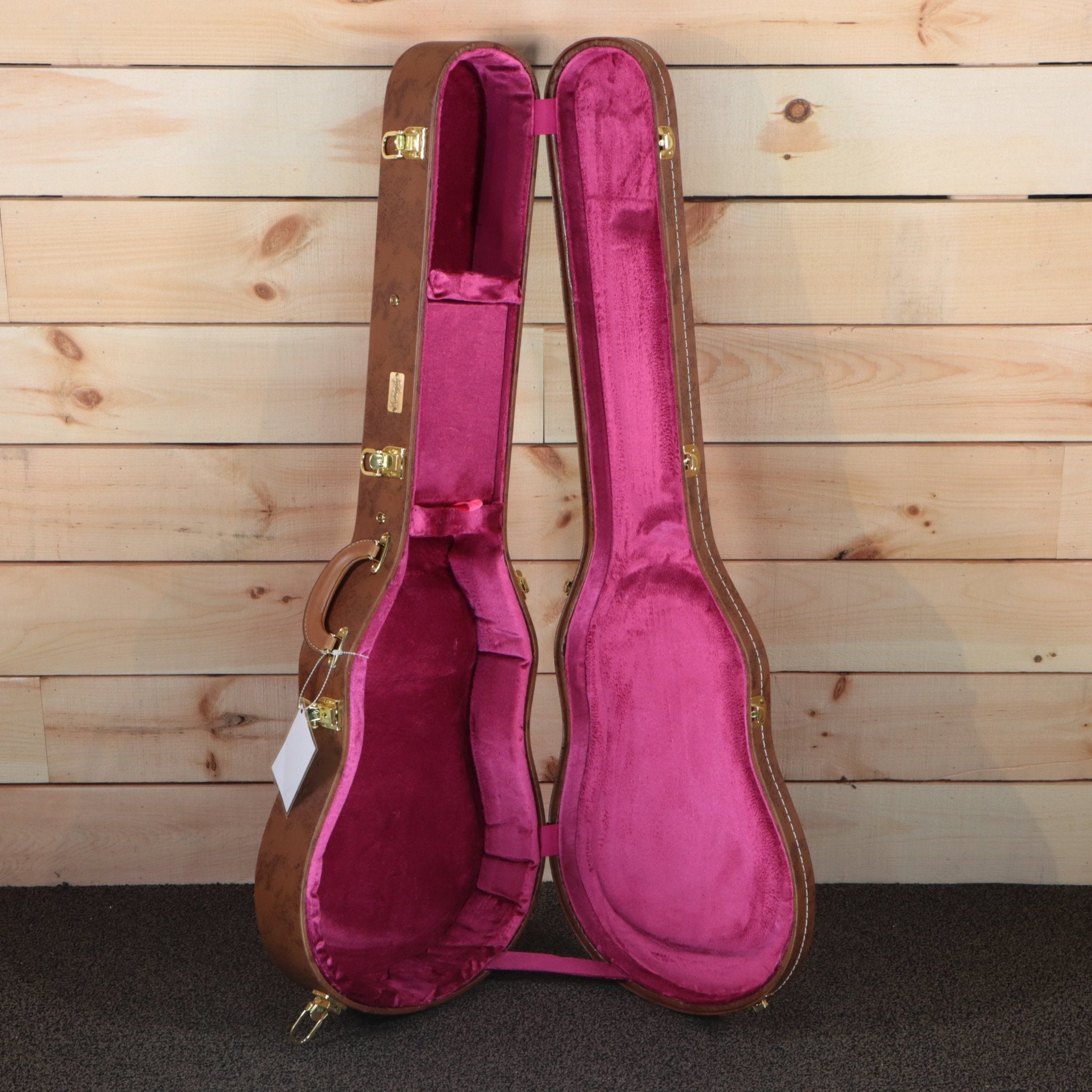 Gibson Les Paul hardshell guitar case brown exterior with pink velvet interior and gold hardware latches