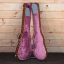 Gibson Les Paul Standard 1960 brown hardshell case open showing purple velvet interior lining
