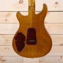PRS Private Stock 513 electric guitar natural finish back view with dark wood control cavity covers and gold hardware