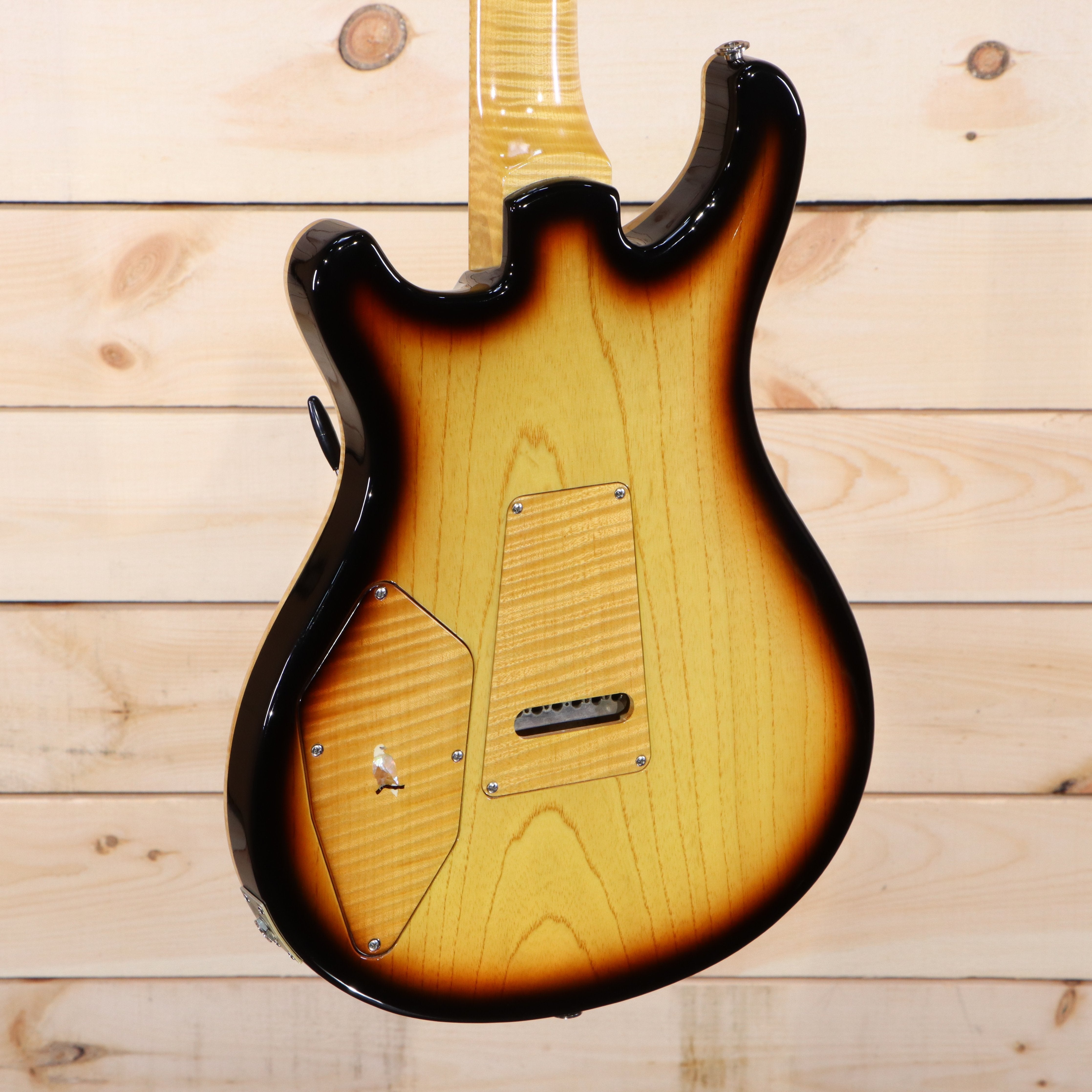 PRS Private Stock 513 electric guitar sunburst finish showing figured maple back panel and tremolo cavity cover