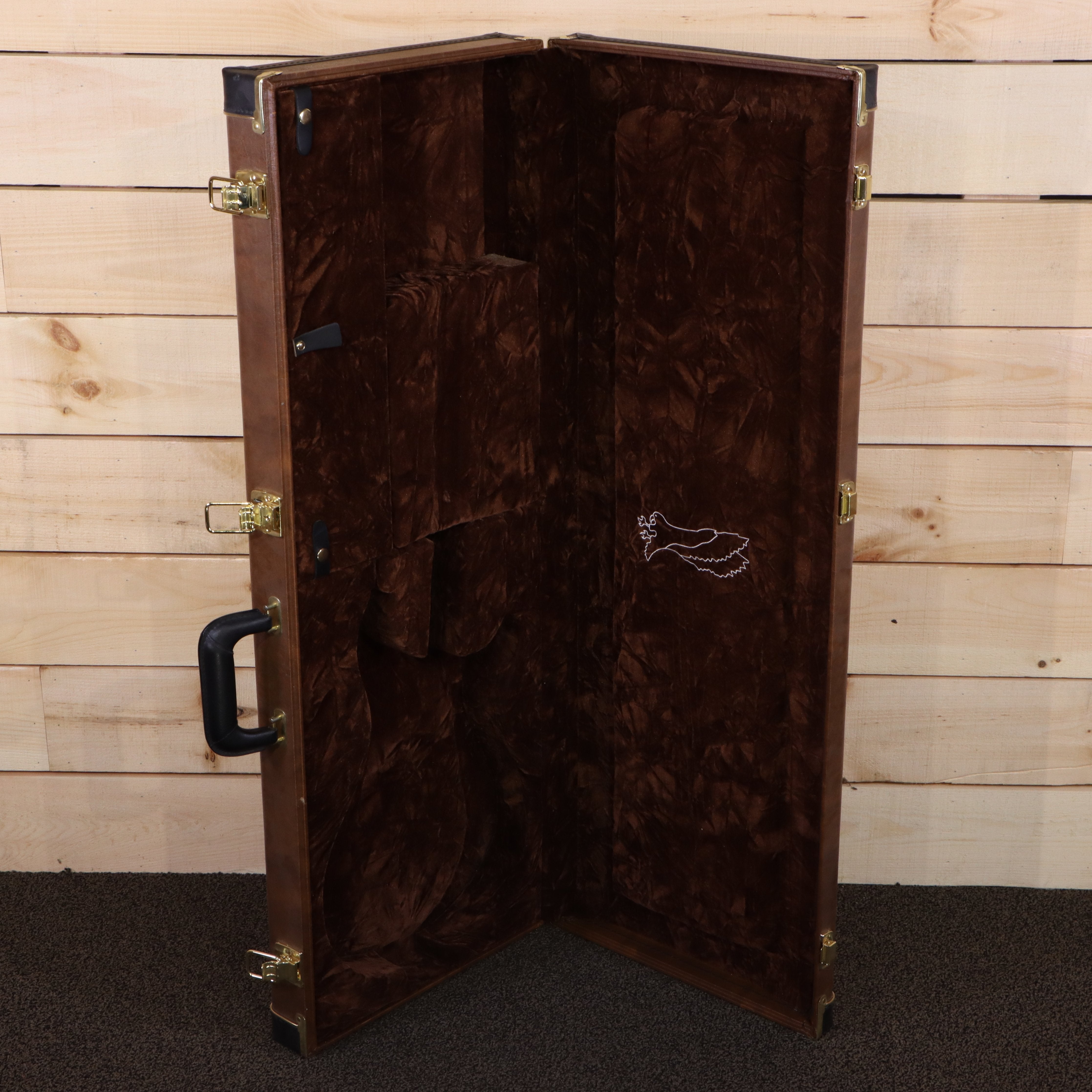 PRS Private Stock Custom 24 brown velvet-lined hardshell guitar case with gold hardware and embroidered bird logo
