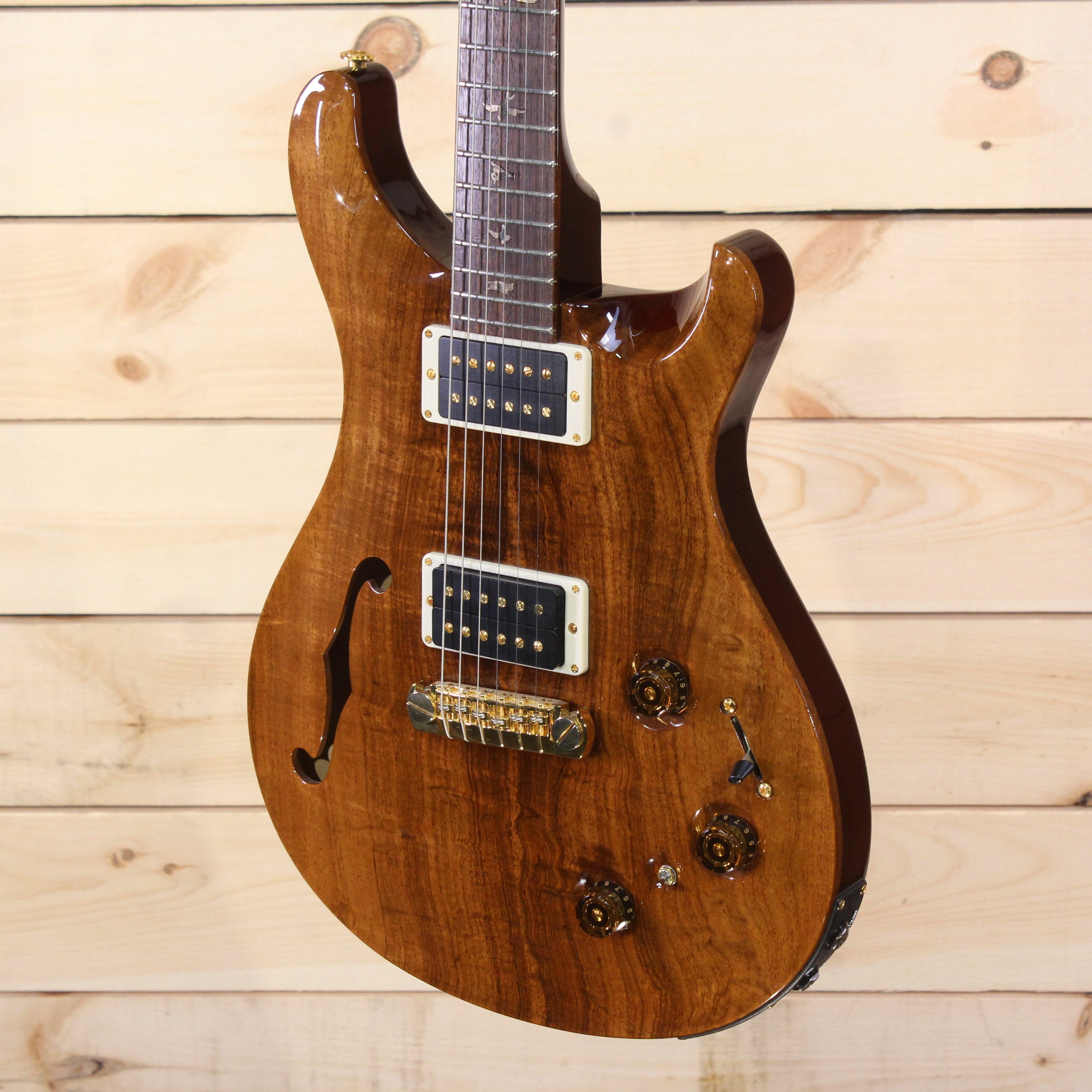 PRS Private Stock Custom 22 semi-hollow electric guitar natural wood finish with gold hardware and dual humbuckers