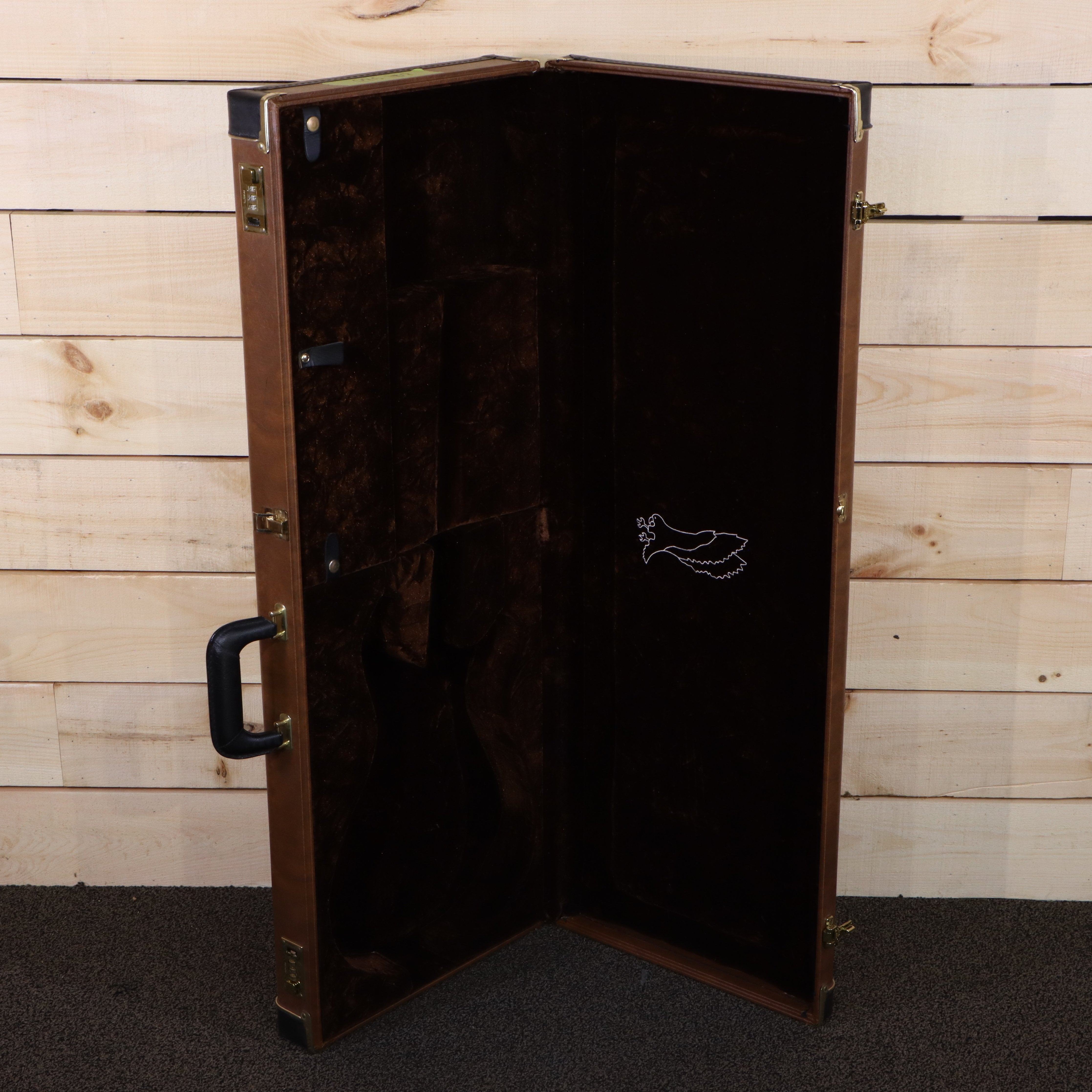 PRS Private Stock brown hardshell guitar case with dark brown velvet interior and dove embroidery
