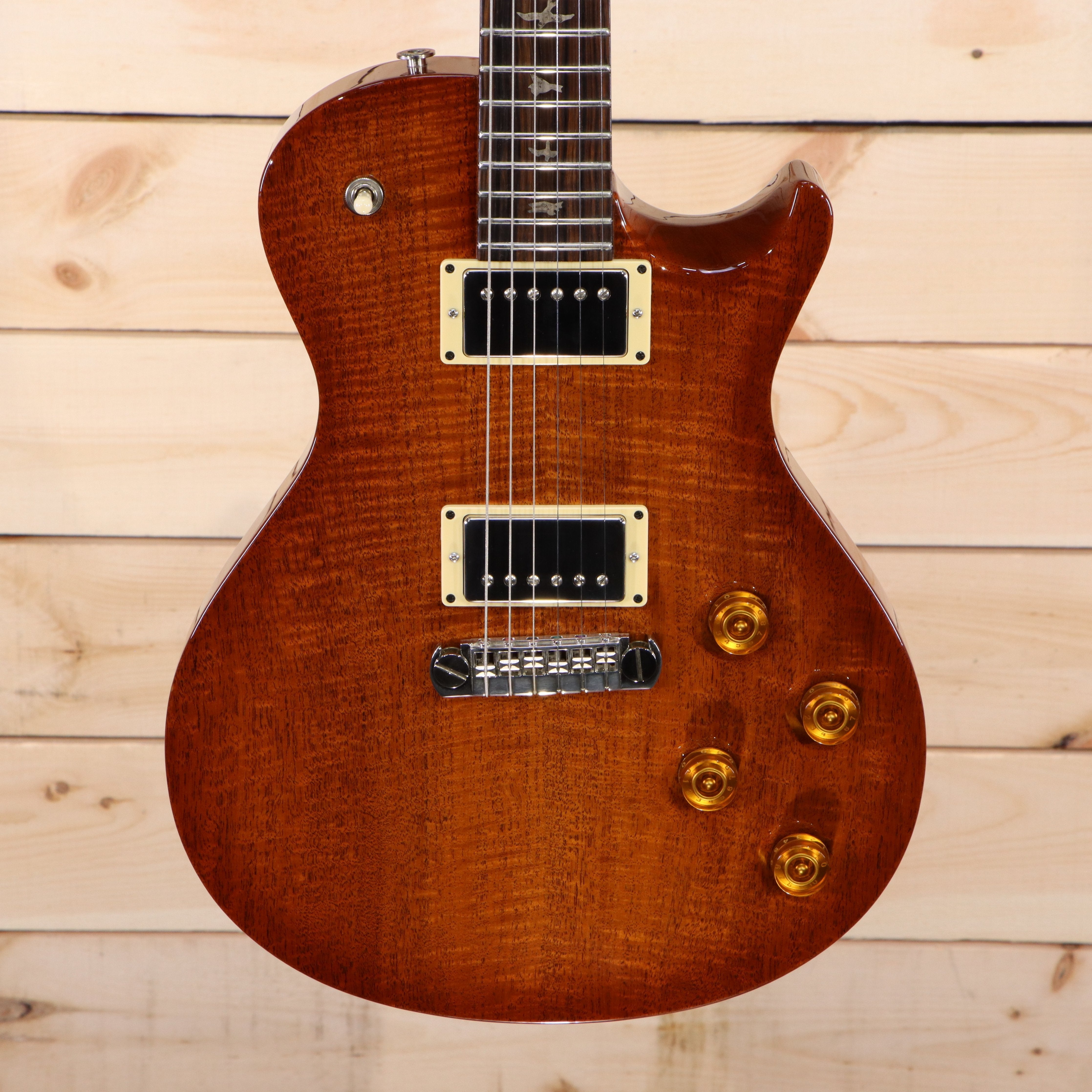 PRS Singlecut electric guitar Les Paul-style flamed maple top amber burst finish with cream-bound humbuckers