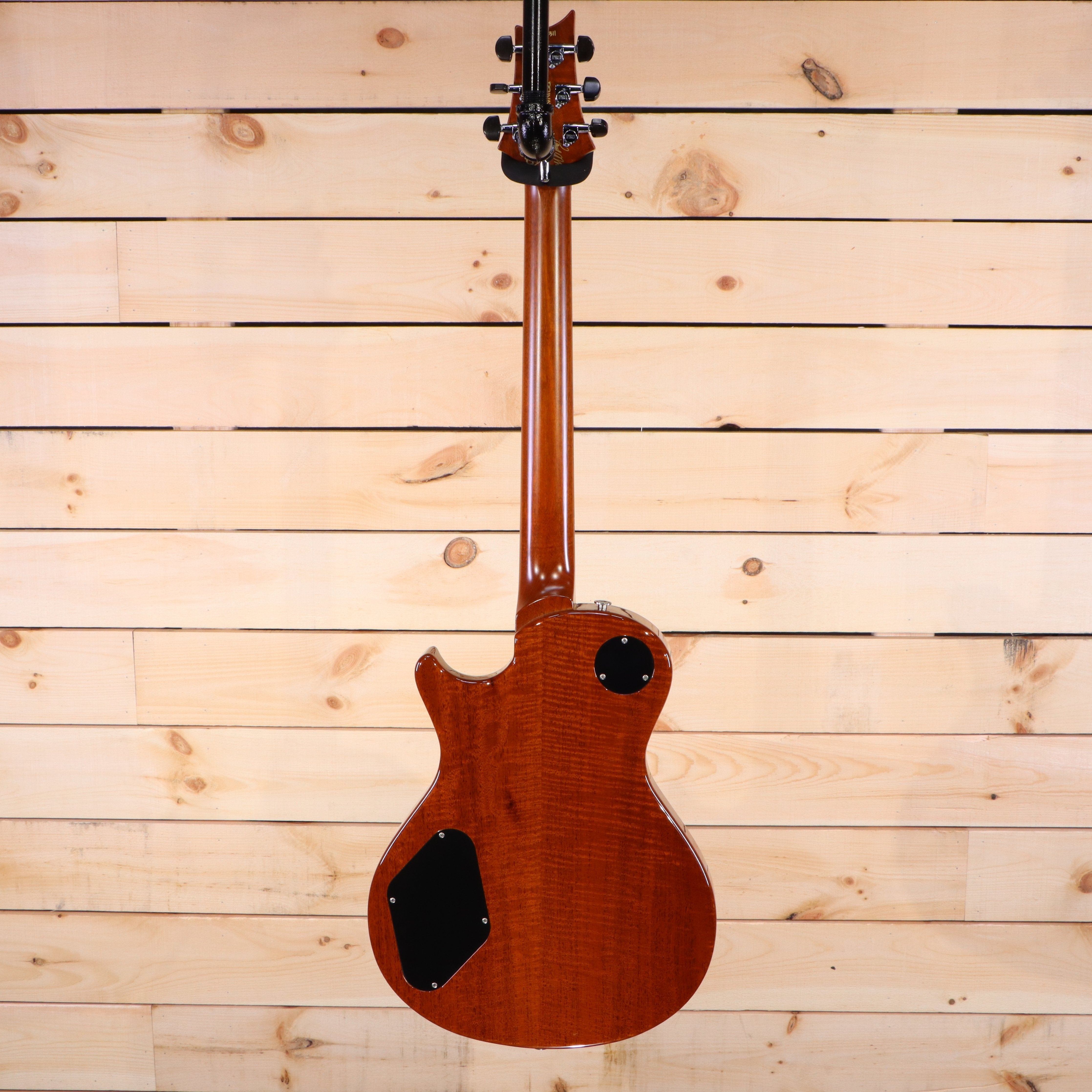 PRS Singlecut electric guitar back view flamed maple body natural finish with black control cavity covers