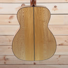Santa Cruz OM Grand Custom Natural acoustic guitar back showing quilted sycamore two-piece back with center seam binding