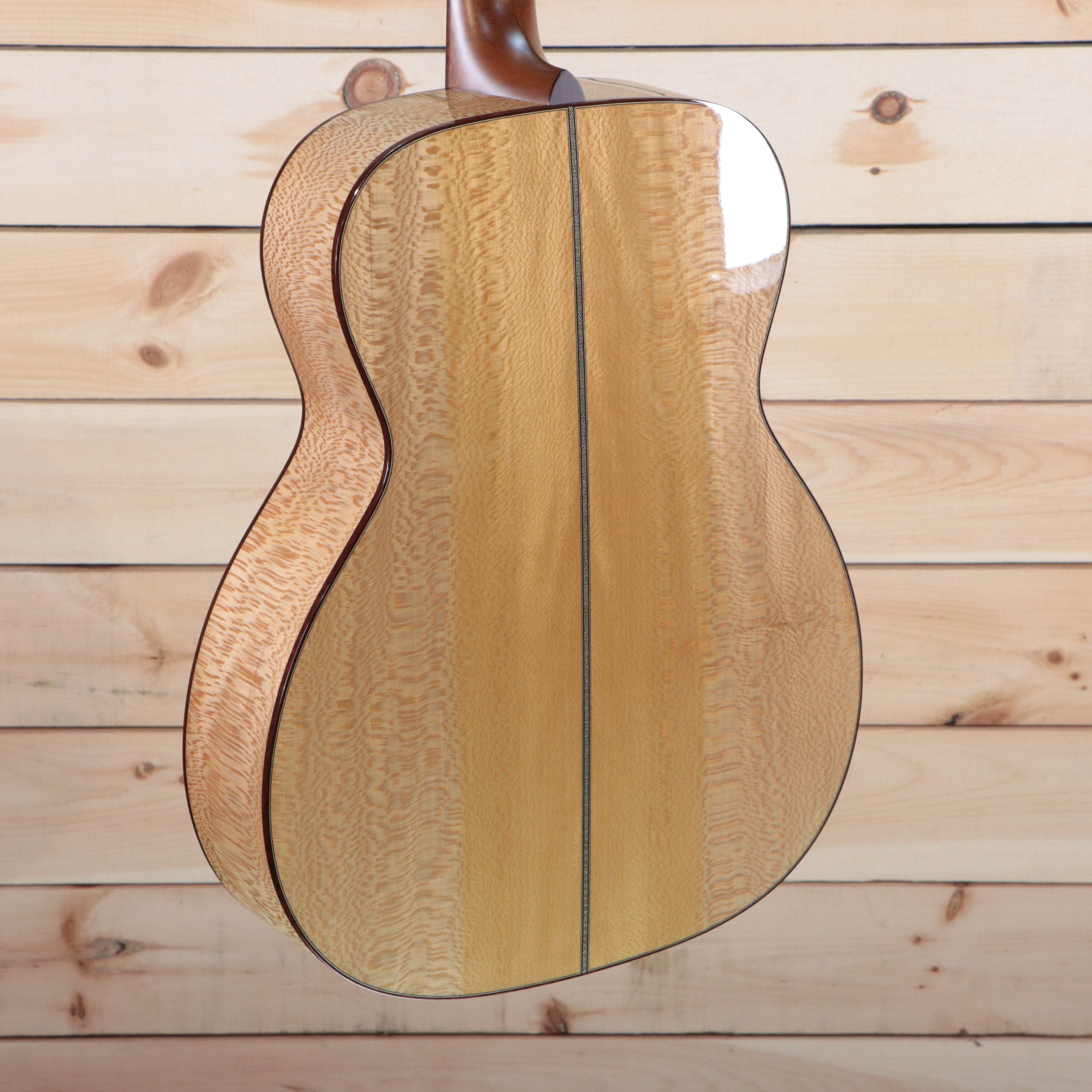 Santa Cruz OM Grand Custom natural finish acoustic guitar with figured maple back and sides center seam