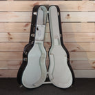 Santa Cruz OM Grand Custom acoustic guitar case open showing cream interior padding and chrome hardware latches