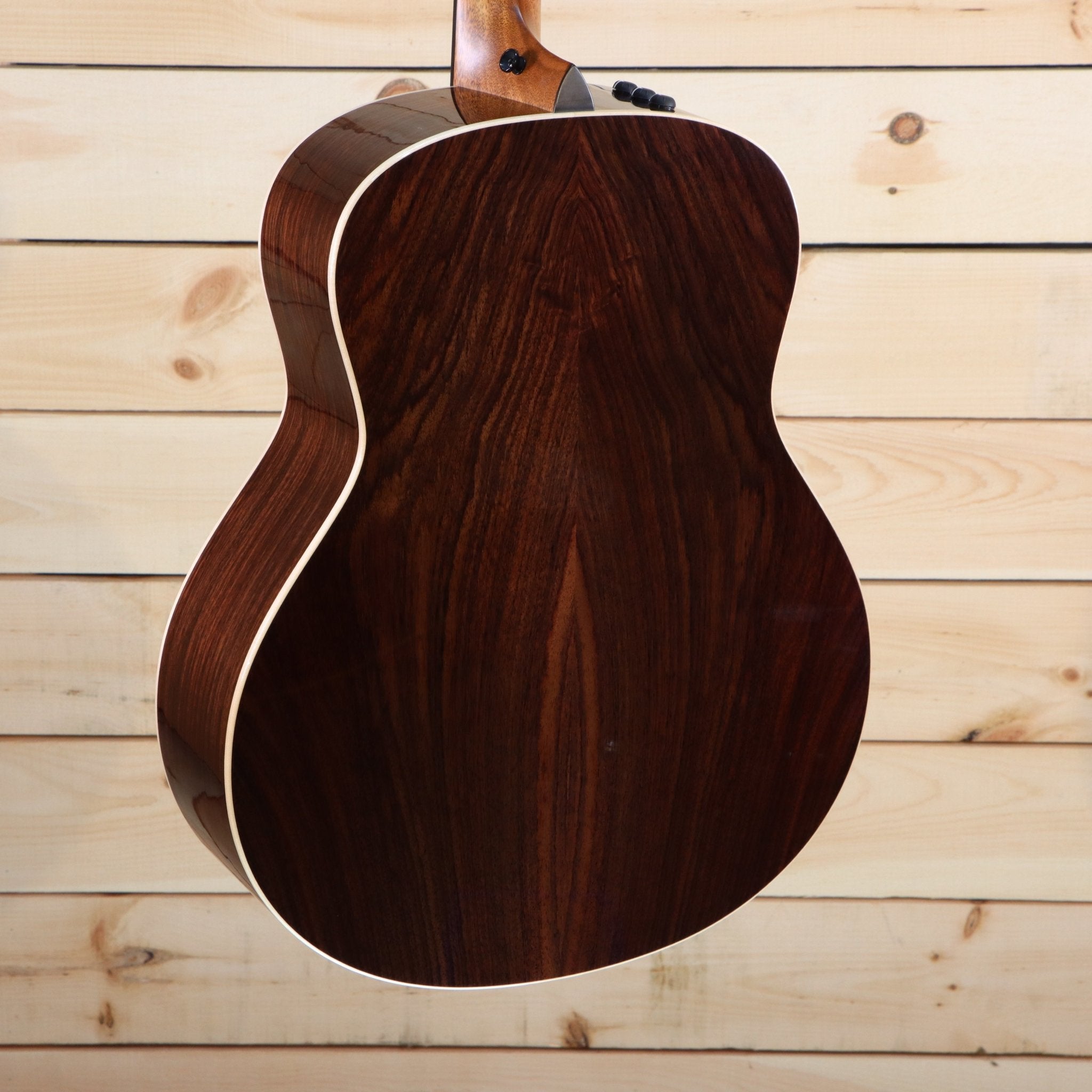 Taylor 818e Grand Orchestra acoustic-electric guitar rosewood back with bookmatched grain and white binding