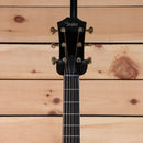 Taylor 2022 Custom GA acoustic guitar black finish with gold tuners and ebony fretboard headstock view