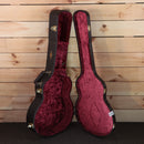 Taylor K26ce Grand Symphony acoustic-electric guitar case open showing burgundy velvet interior gold hardware