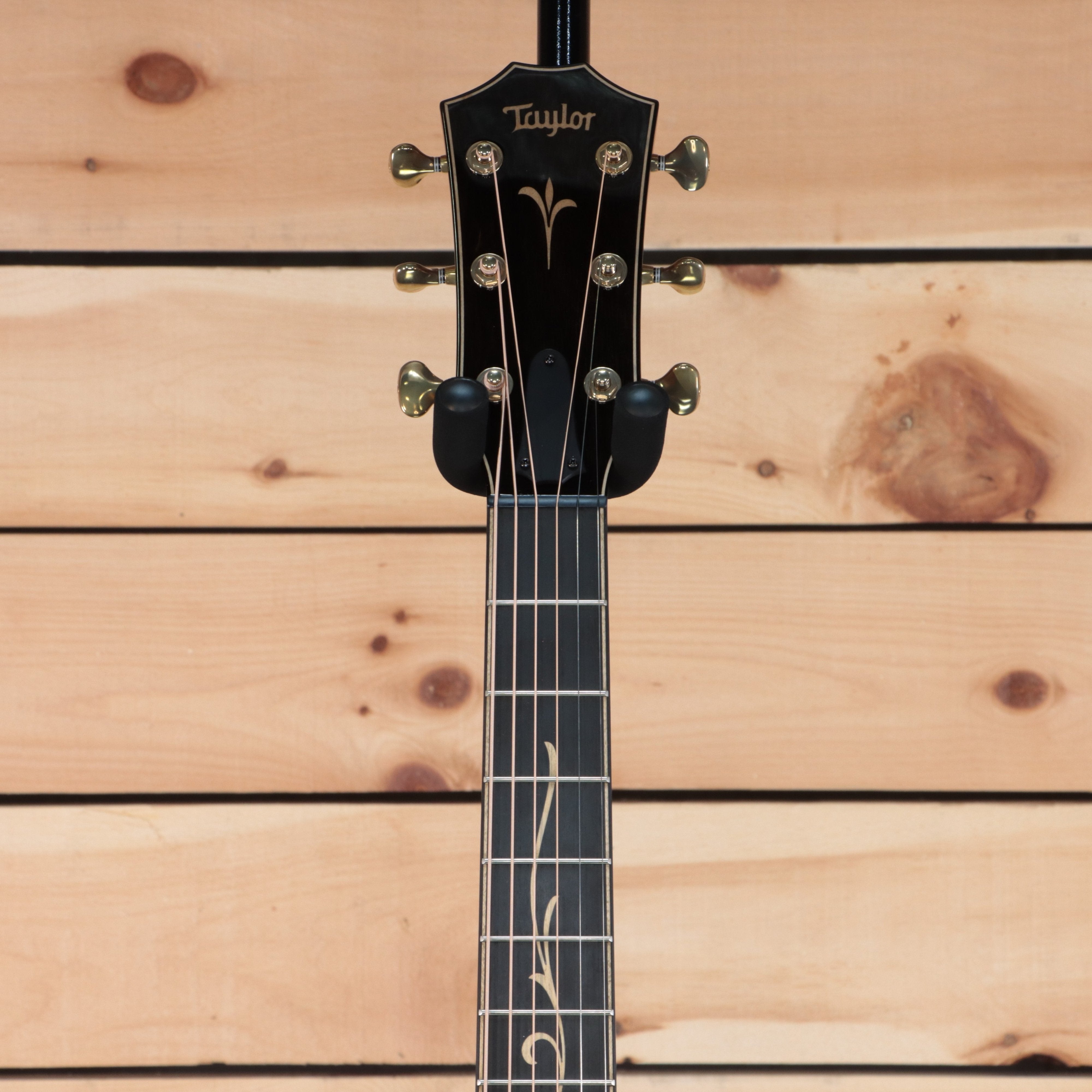 Taylor K26ce Grand Symphony acoustic-electric guitar black headstock with gold tuners and floral fretboard inlay