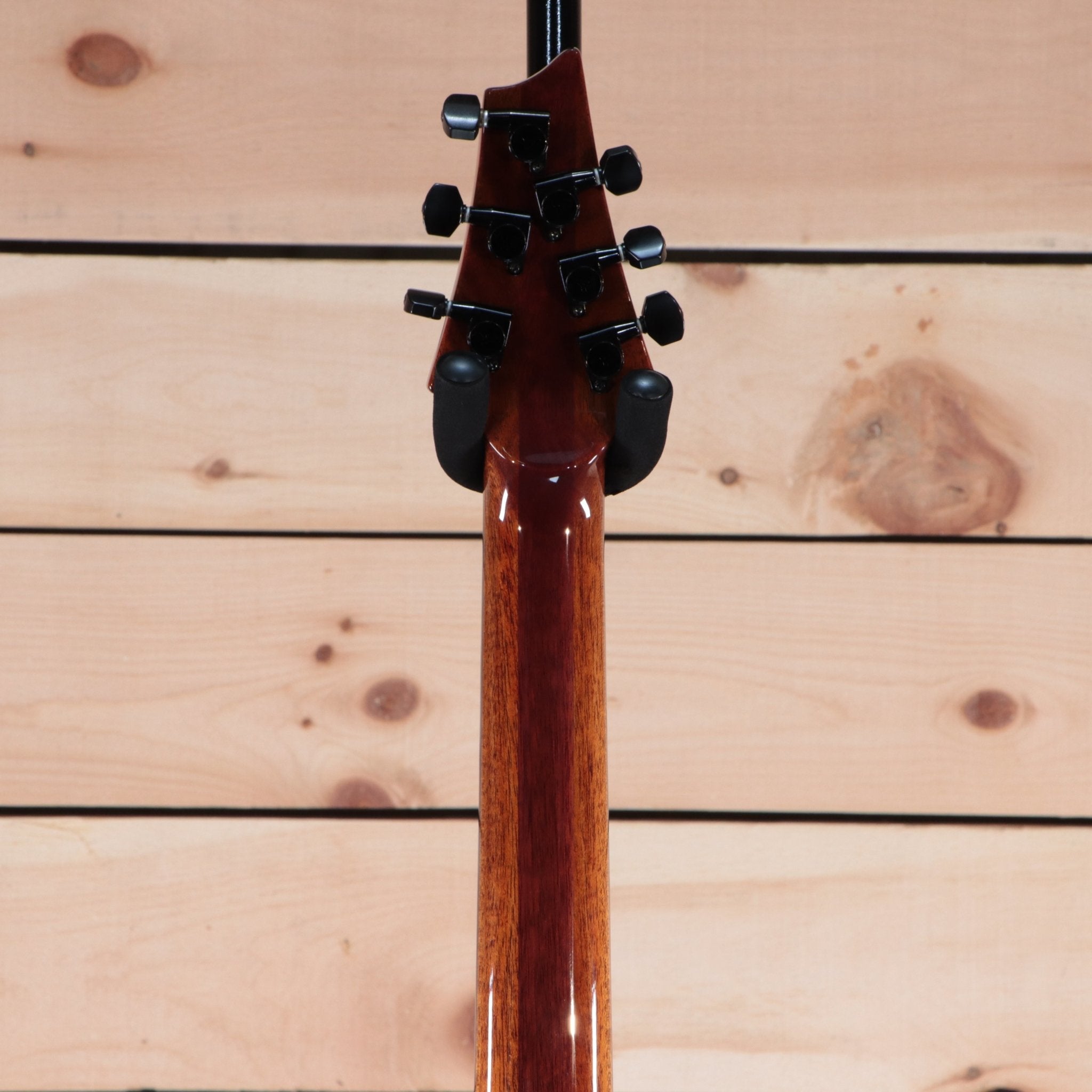 Warrior The Passion electric guitar back view mahogany neck with black tuning machines gloss finish