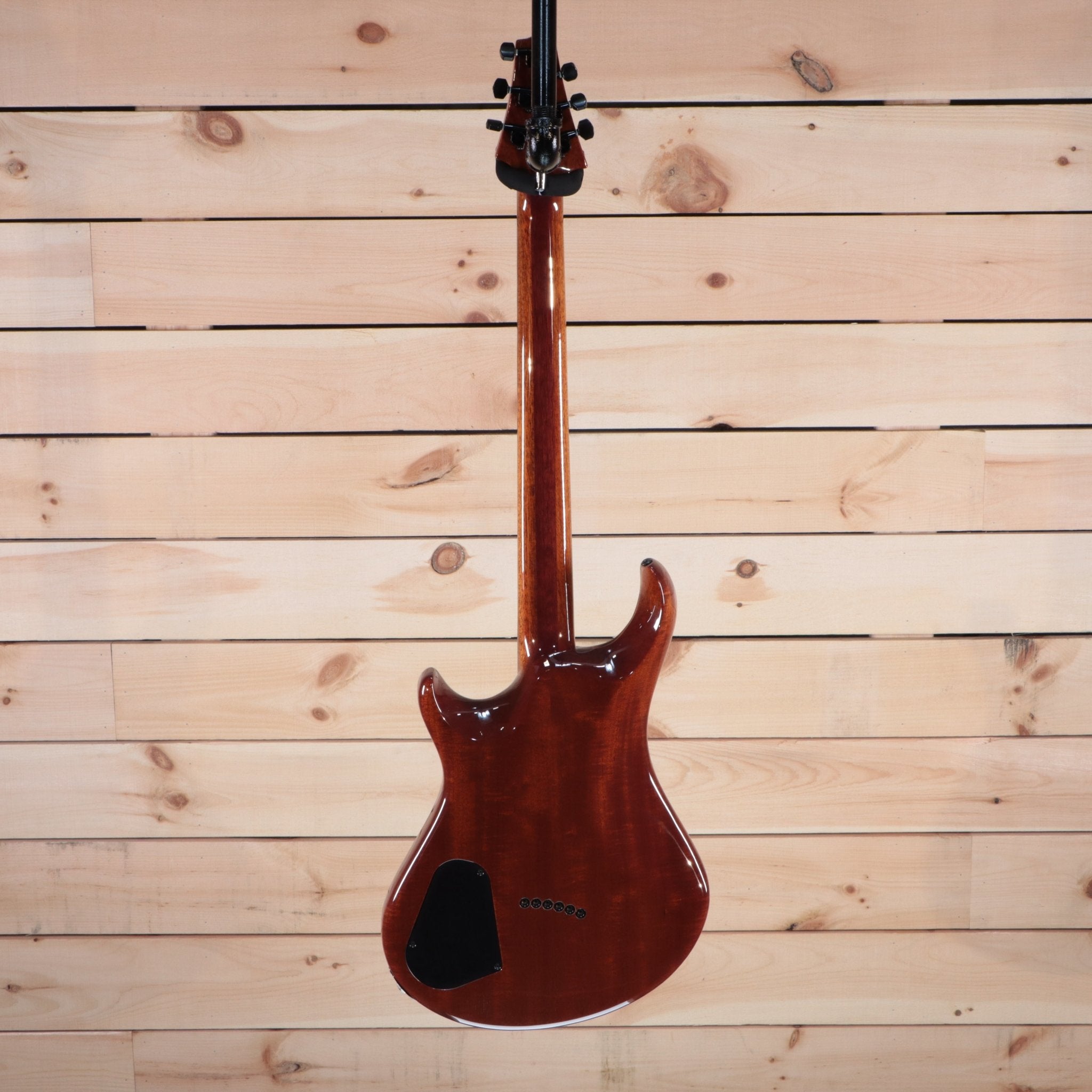 Warrior The Passion electric guitar mahogany body back view with black control cavity cover and neck-through construction